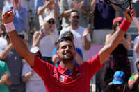 | Photo: AP/Andy Wong : Novak Djokovic celebrates after defeating Rafael Nadal